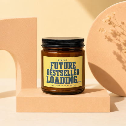 Amber candle with text "STATUS: FUTURE BESTSELLER LOADING..." on a yellow label.