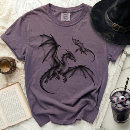 Purple t-shirt with two black dragons graphic and text "YOU WANT A DRAGON? EARN ONE."