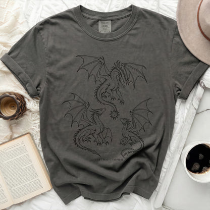 Charcoal Comfort Colors t-shirt with black line art of three dragons and the text "TAIRN / SGAEYL / ANDARNA".