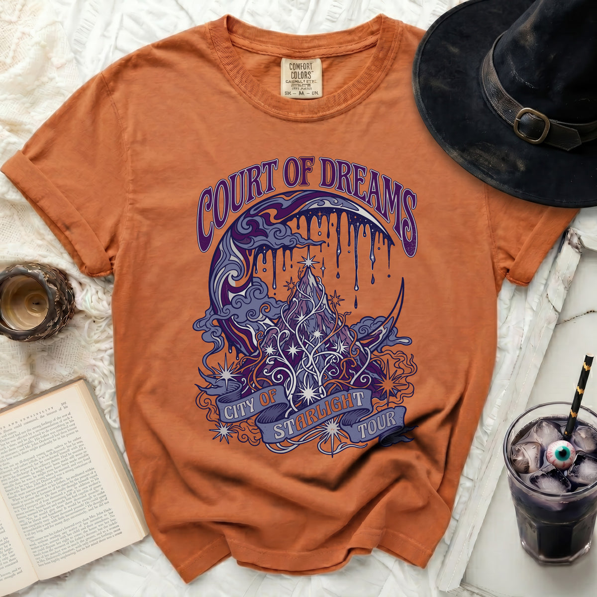 Orange t-shirt with "Court of Dreams City of Starlight Tour" graphic.