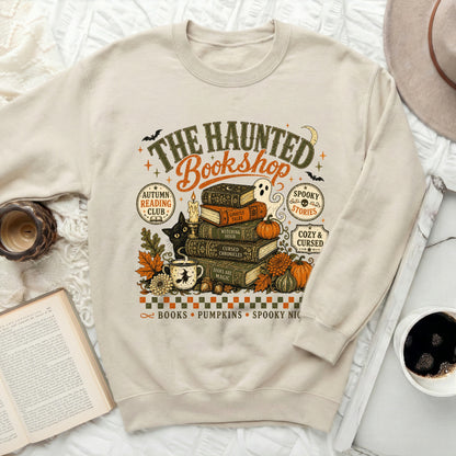 "The Haunted Bookshop" sweatshirt with Halloween-themed illustrations.