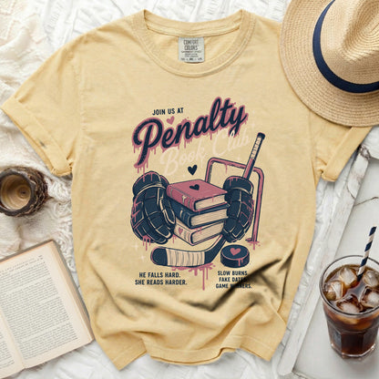 Yellow t-shirt with "JOIN US AT Penalty Book Club" and hockey graphics.