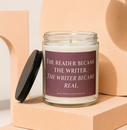 Glass candle with label reading "The reader became the writer. The writer became real."