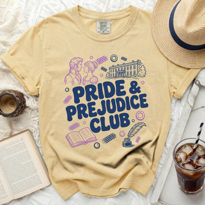 Yellow t-shirt with "Pride & Prejudice Club" graphic and regal scene.