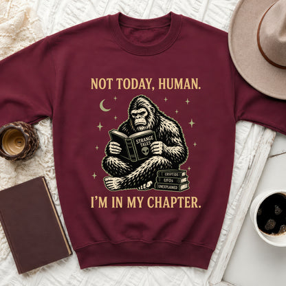 Maroon sweatshirt with Bigfoot reading "Strange Tales" and text "Not Today, Human. I'm In My Chapter."