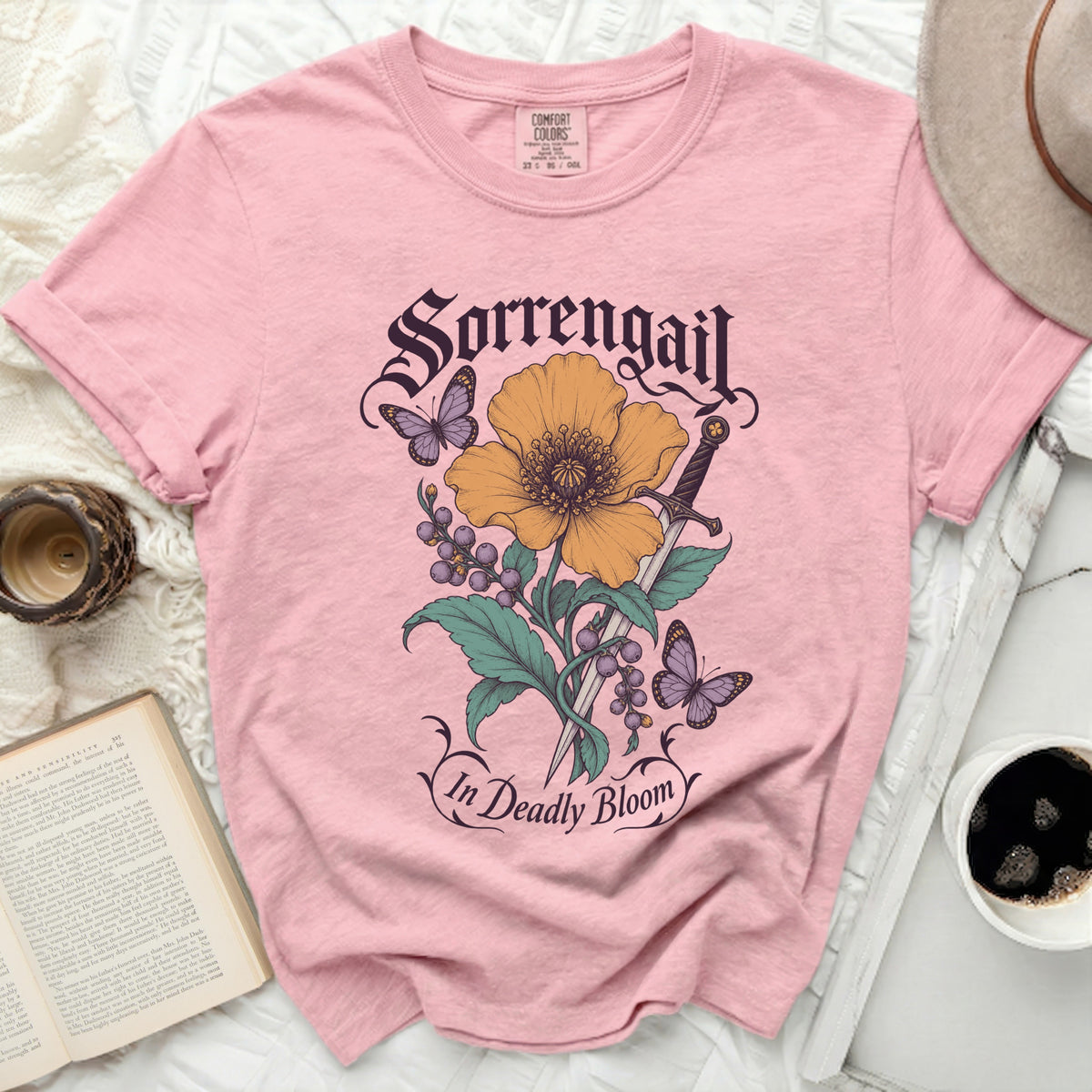 Pink t-shirt with "Sorrengail In Deadly Bloom" text and floral graphic.