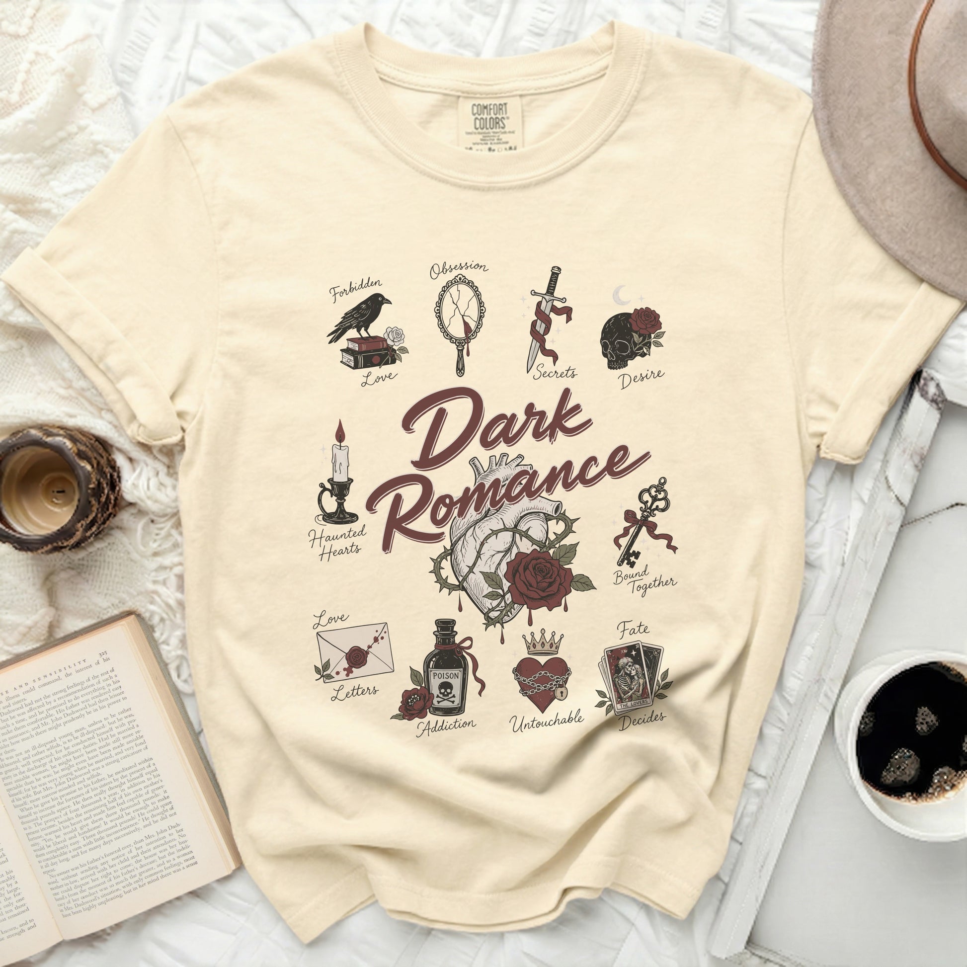 Cream t-shirt with "Dark Romance" text and gothic illustrations.