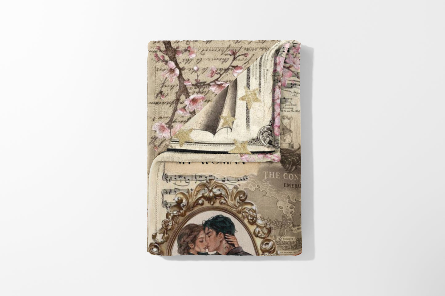 Blanket with vintage collage: cherry blossoms, sheet music, stars, and an oval portrait of a kissing couple.