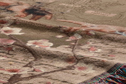The image is a close-up of a fabric with a floral pattern, featuring a mix of pink and white flowers against a brown background.