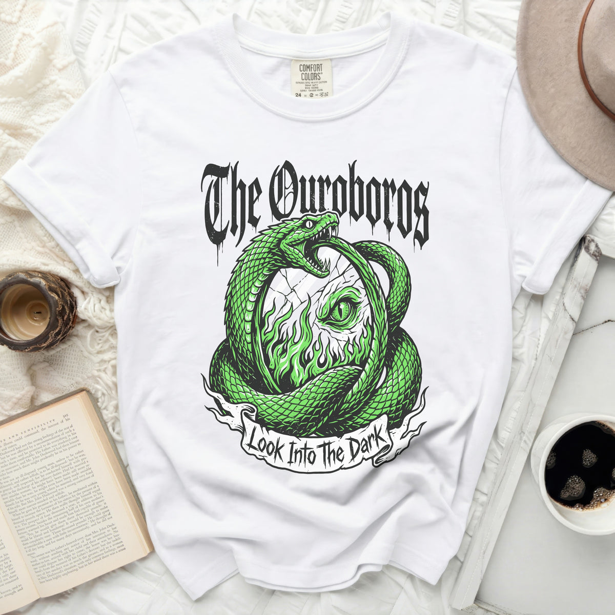 White t-shirt with green Ouroboros snake design and "The Ouroboros Look Into The Dark" text.