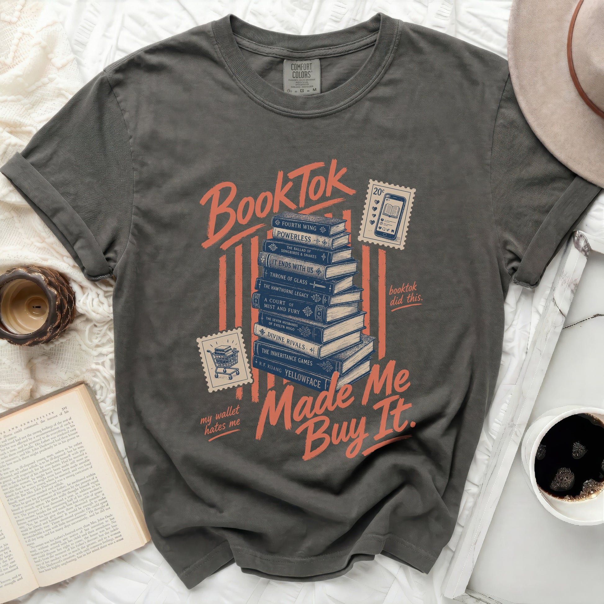 Grey t-shirt with "BookTok made me buy it" and stacked book titles.