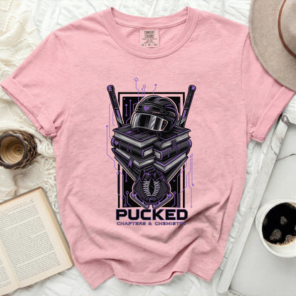 Pink t-shirt with "Pucked Chapters & Chemistry" hockey graphic.