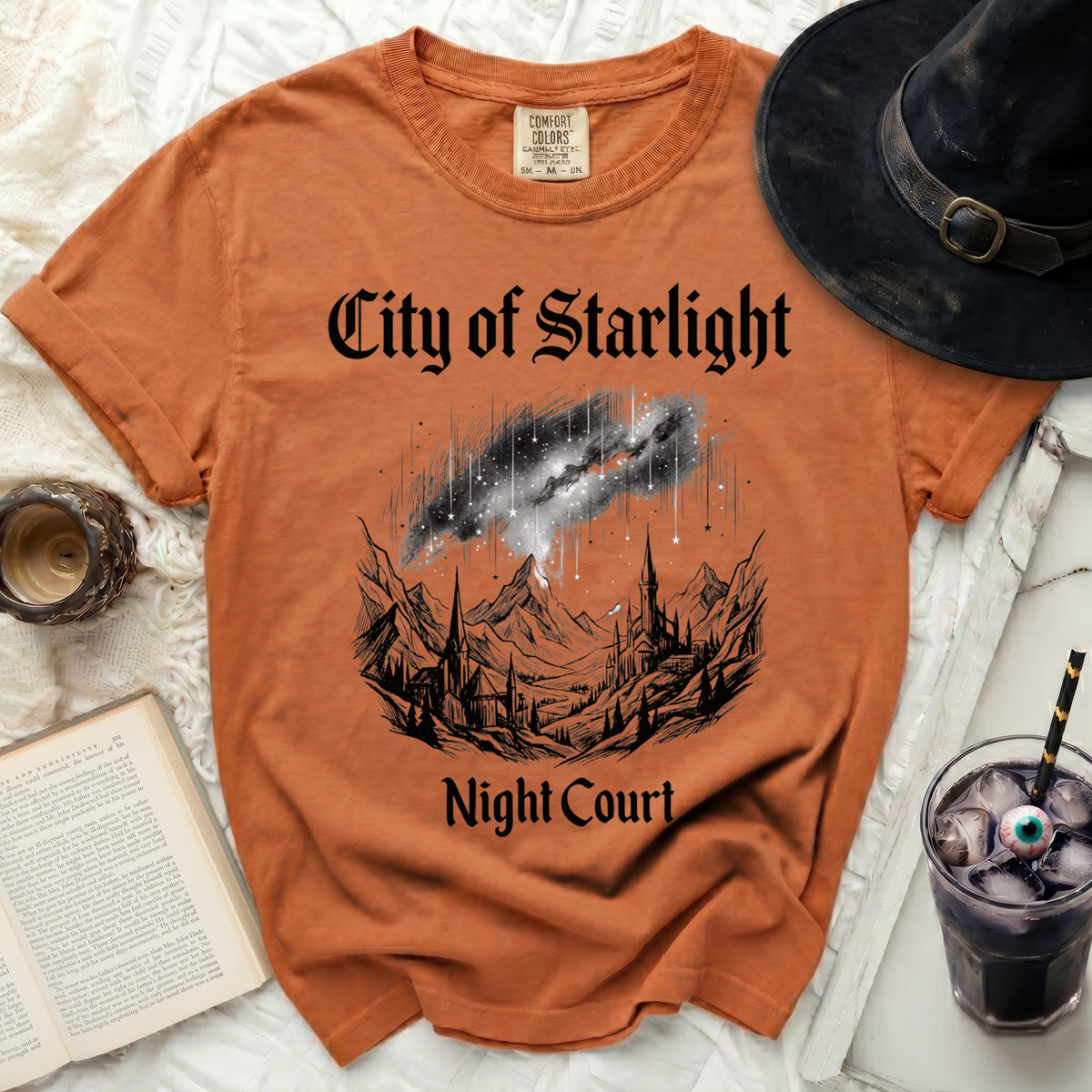 Orange t-shirt with "City of Starlight Night Court" and castle graphic.