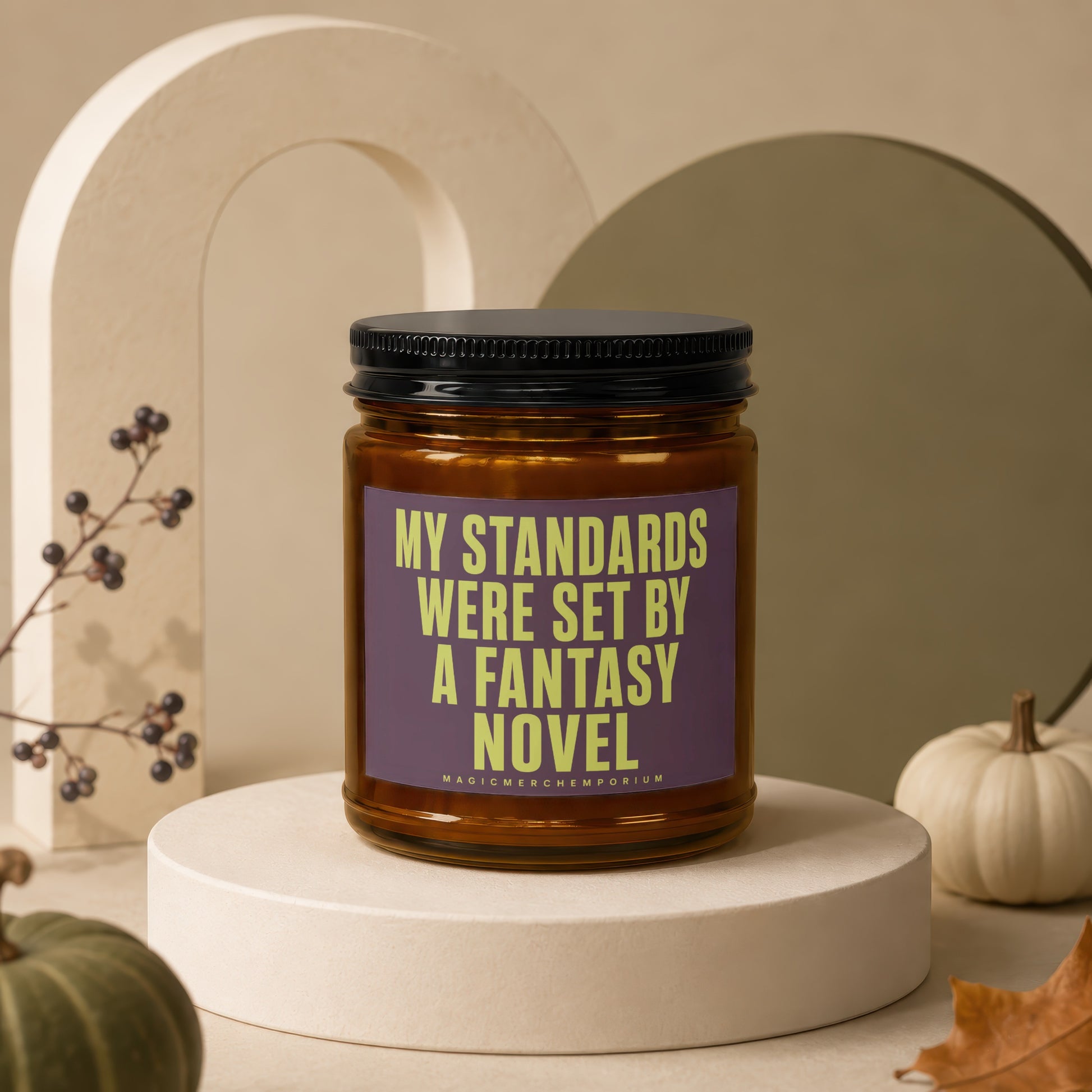 Candle with text "My Standards Were Set By A Fantasy Novel" on purple label.