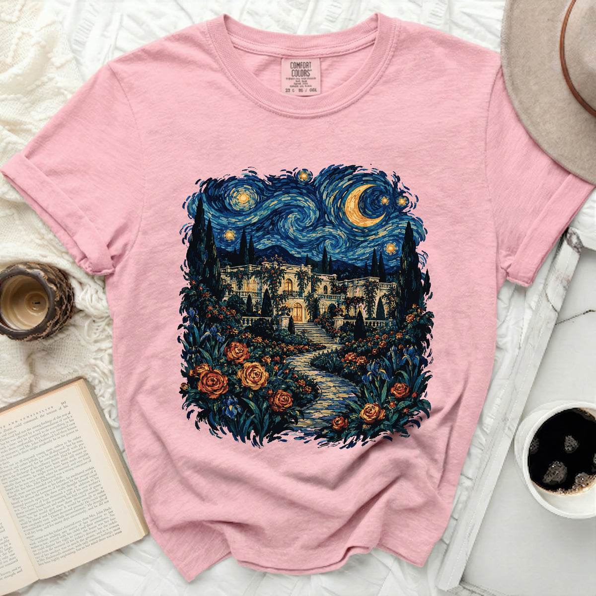 Pink t-shirt with a starry night garden painting featuring a mansion and roses.