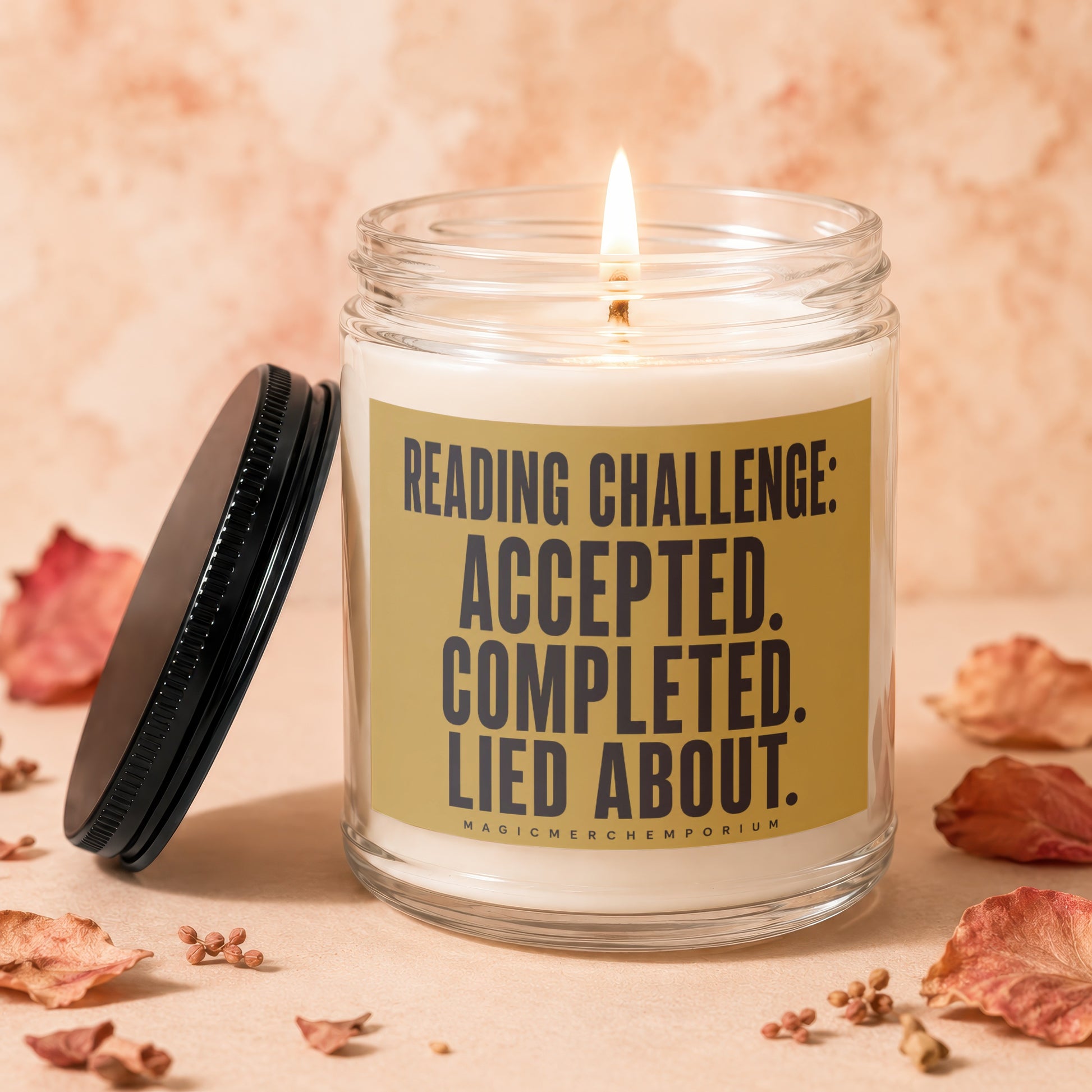 Lit candle in glass jar labeled "Reading Challenge: Accepted. Completed. Lied About."