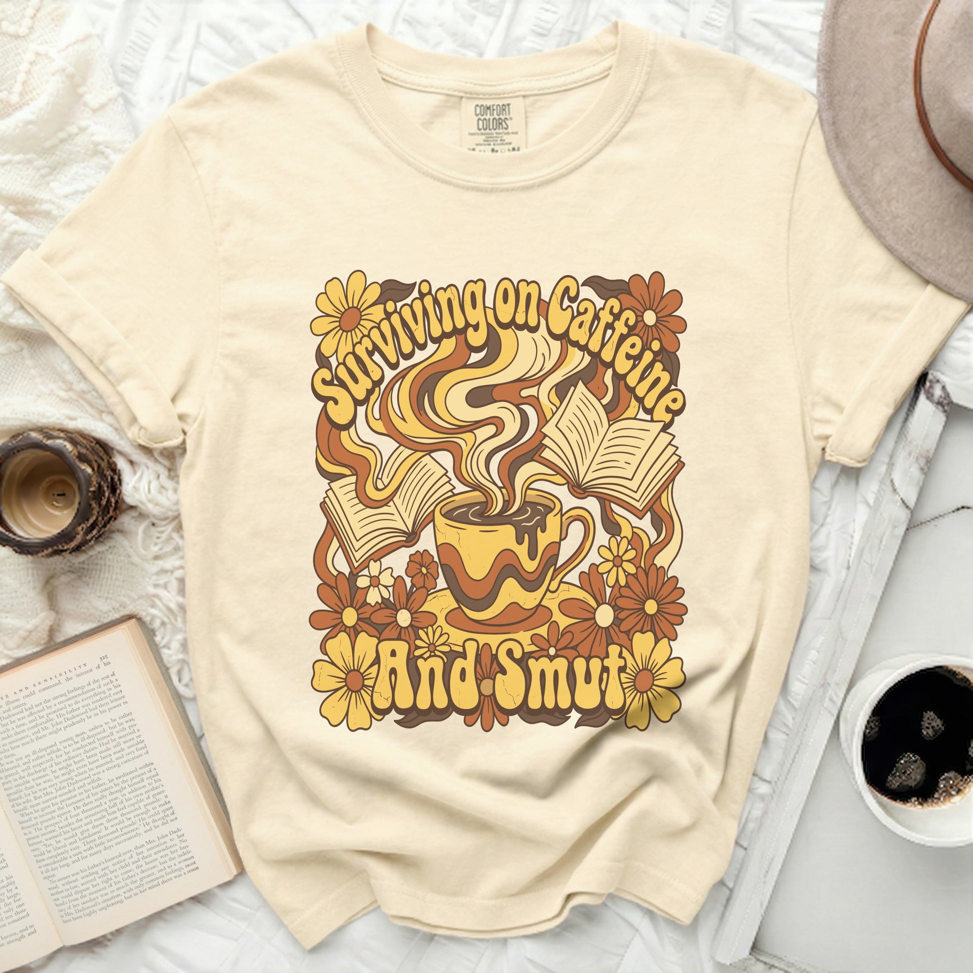 Comfort Colors shirt with "Surviving on Caffeine And Smut" retro graphic.