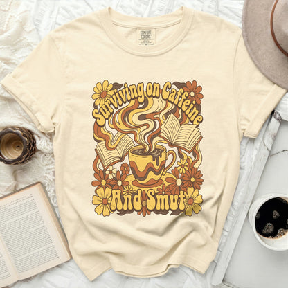 Comfort Colors shirt with "Surviving on Caffeine And Smut" retro graphic.