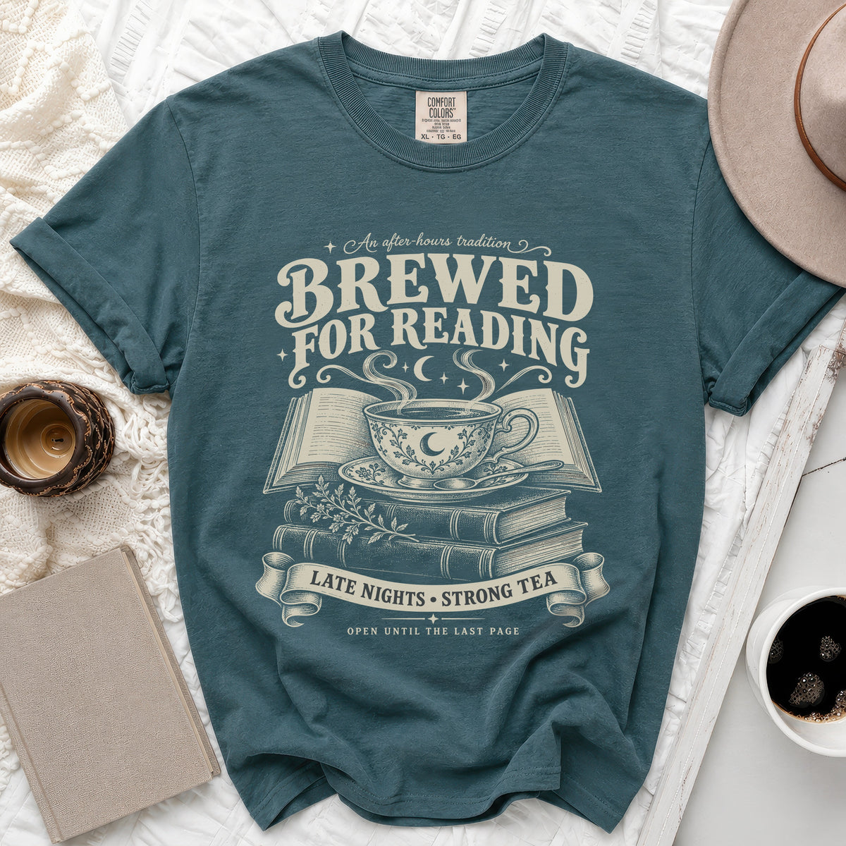 T-shirt with text "Brewed for Reading" and a design of a teacup on books.