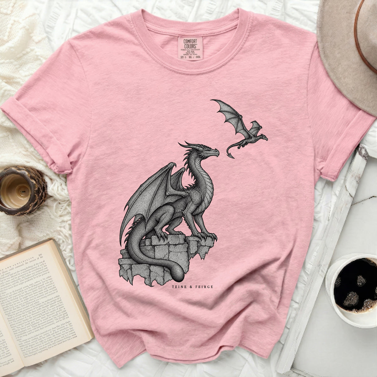 Pink Comfort Colors t-shirt with a detailed print of two dragons and "TEINE & FEIRGE" text.