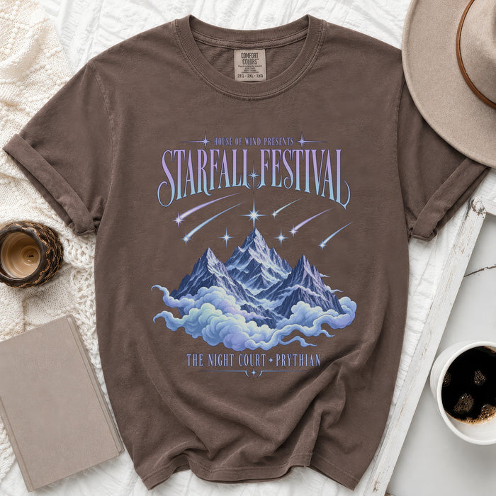 Brown t-shirt with "Starfall Festival" graphic, mountains, clouds, and text.