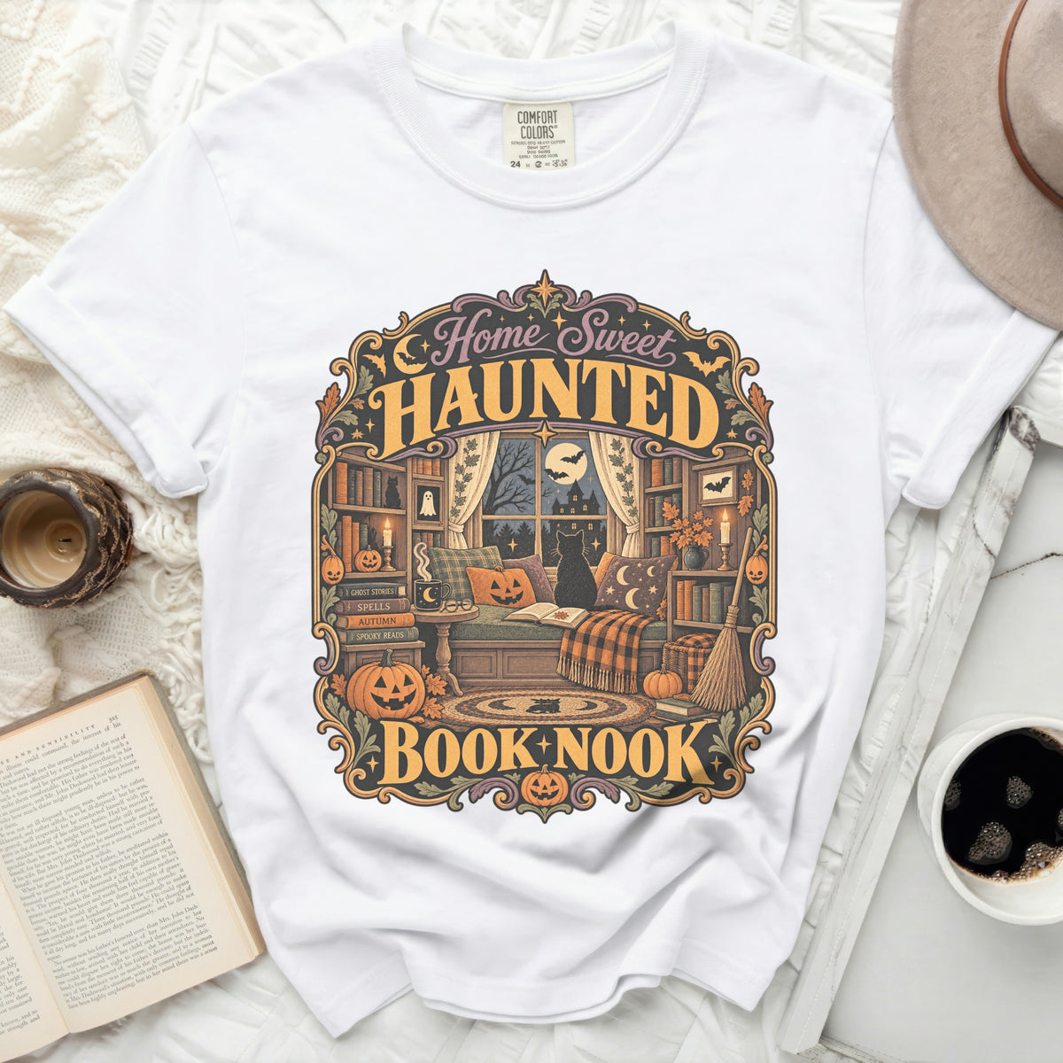White t-shirt with "Home Sweet Haunted Book Nook" Halloween graphic.