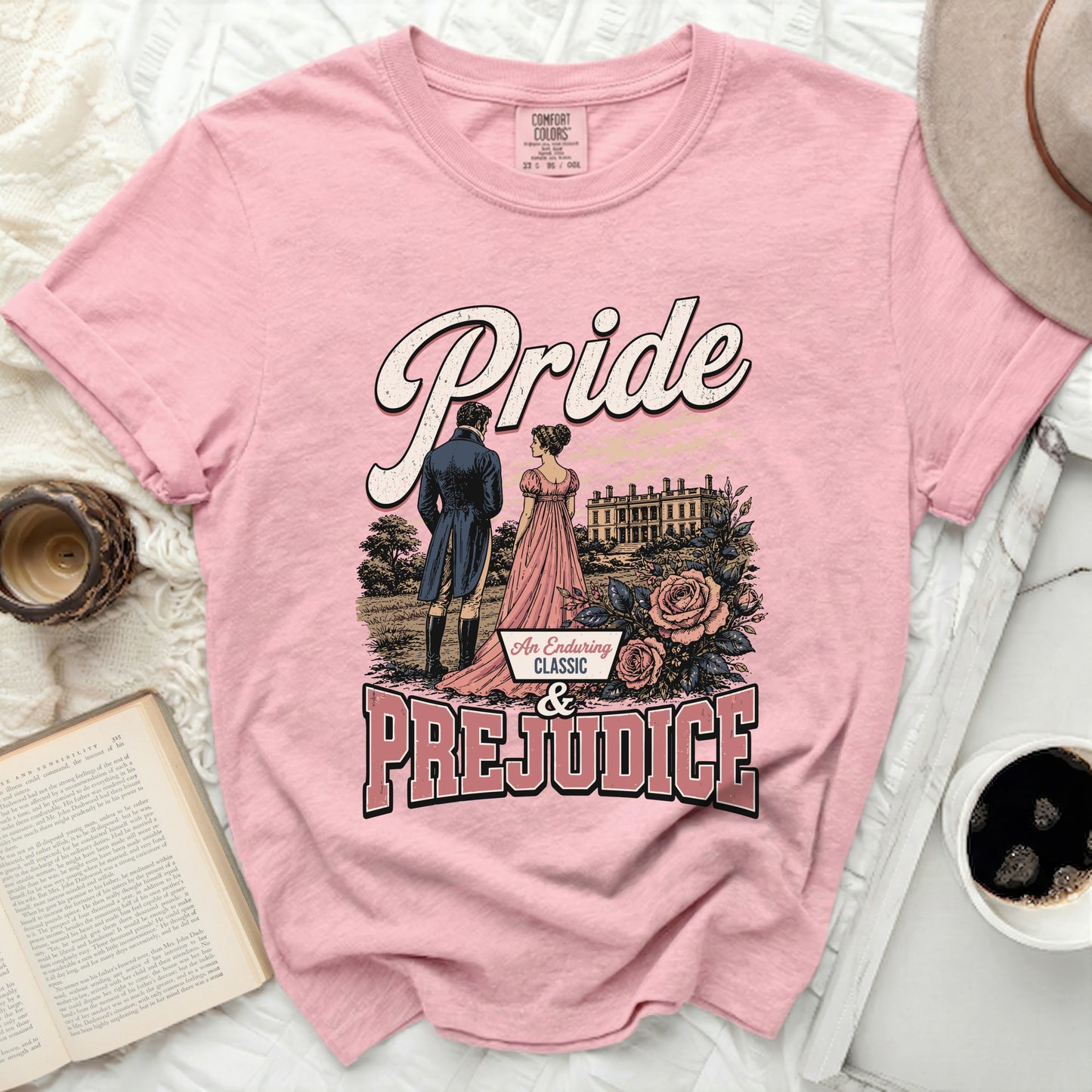 Pink t-shirt with Pride and Prejudice text and illustration.
