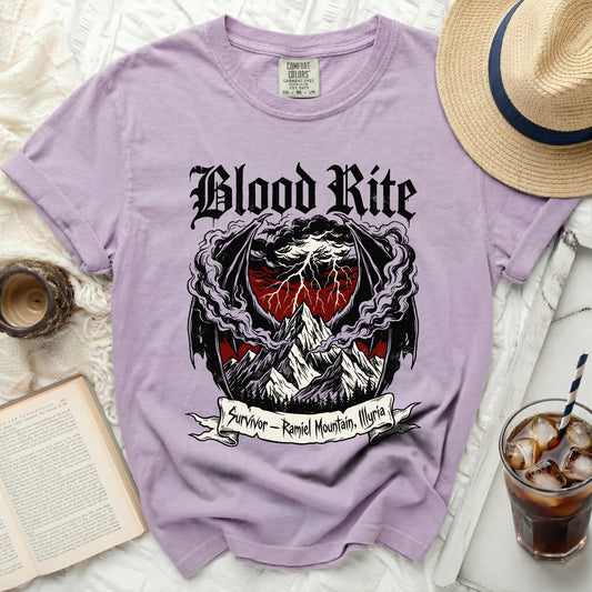Lavender t-shirt with "Blood Rite" and mountain graphic.