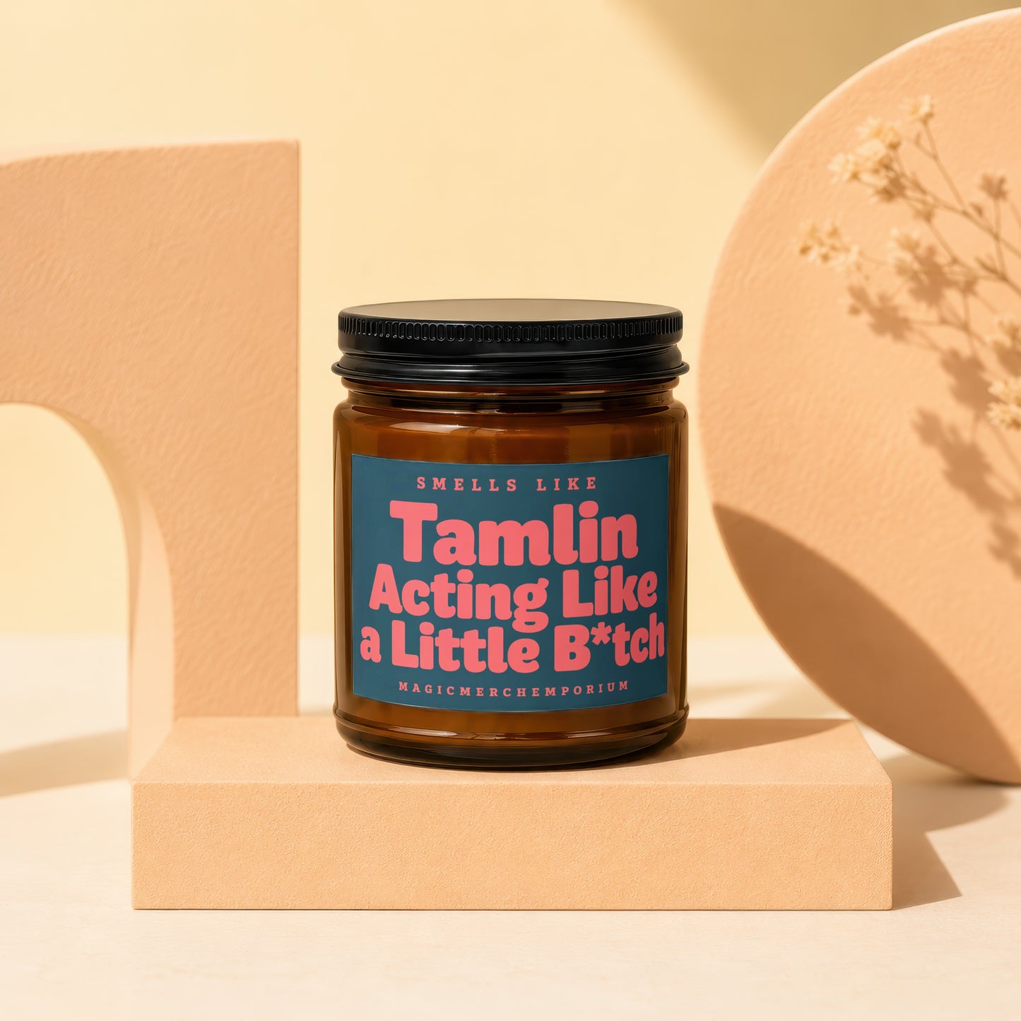 Amber jar candle with black lid labeled "Tamlin Acting Like a Little B*tch".