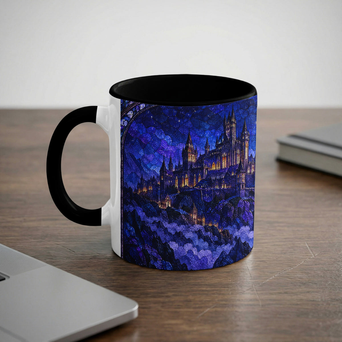 White ceramic mug with a black handle and rim, featuring a blue fantasy castle stained-glass design.