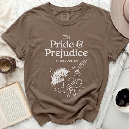 Brown t-shirt with "The Pride & Prejudice by Jane Austen" title and Regency icons.