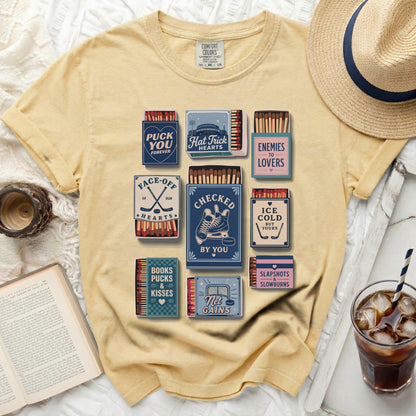 Comfort Colors t-shirt with vintage matchbox graphics for "Puck You Forever" and hockey themes.