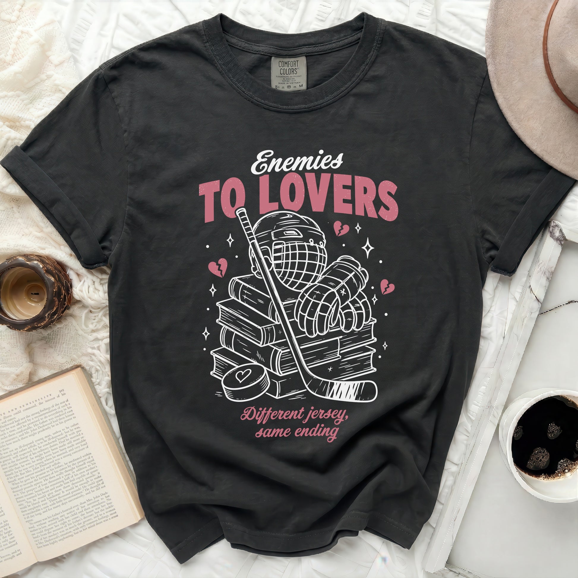 Black t-shirt with "Enemies To Lovers" and hockey graphic.