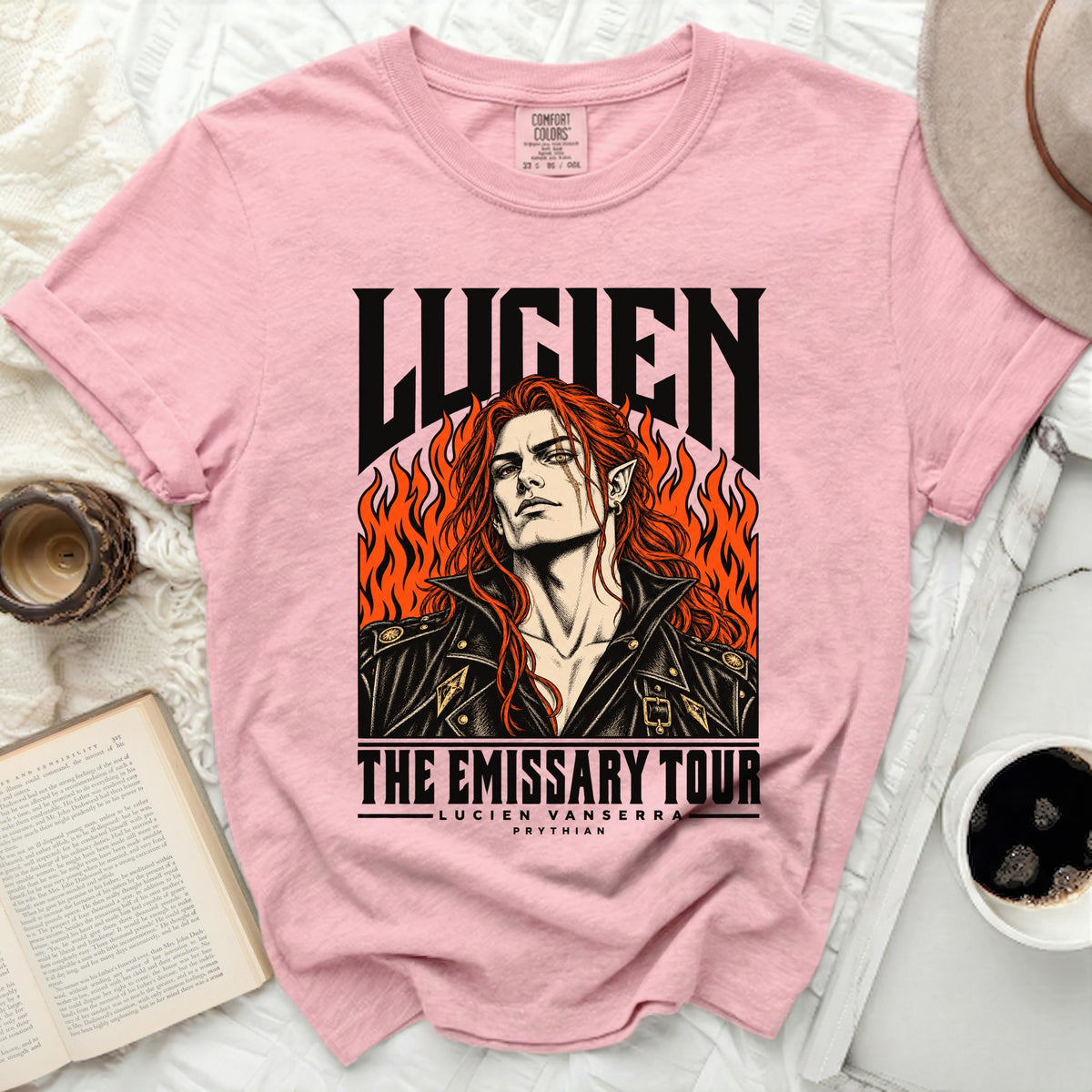 Pink t-shirt with "Lucien The Emissary Tour" graphic featuring a man with red hair.