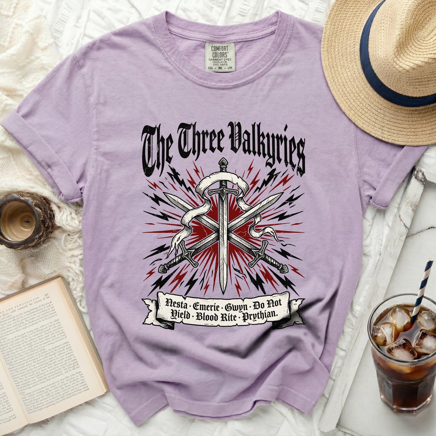 Purple t-shirt with "The Three Valkyries" graphic and text.