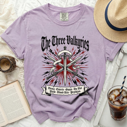 Purple t-shirt with "The Three Valkyries" graphic and text.
