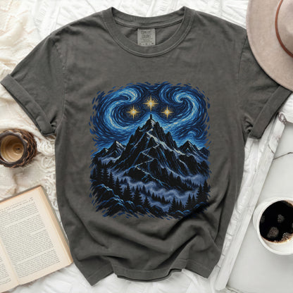 Dark gray t-shirt with a starry night mountain landscape graphic.