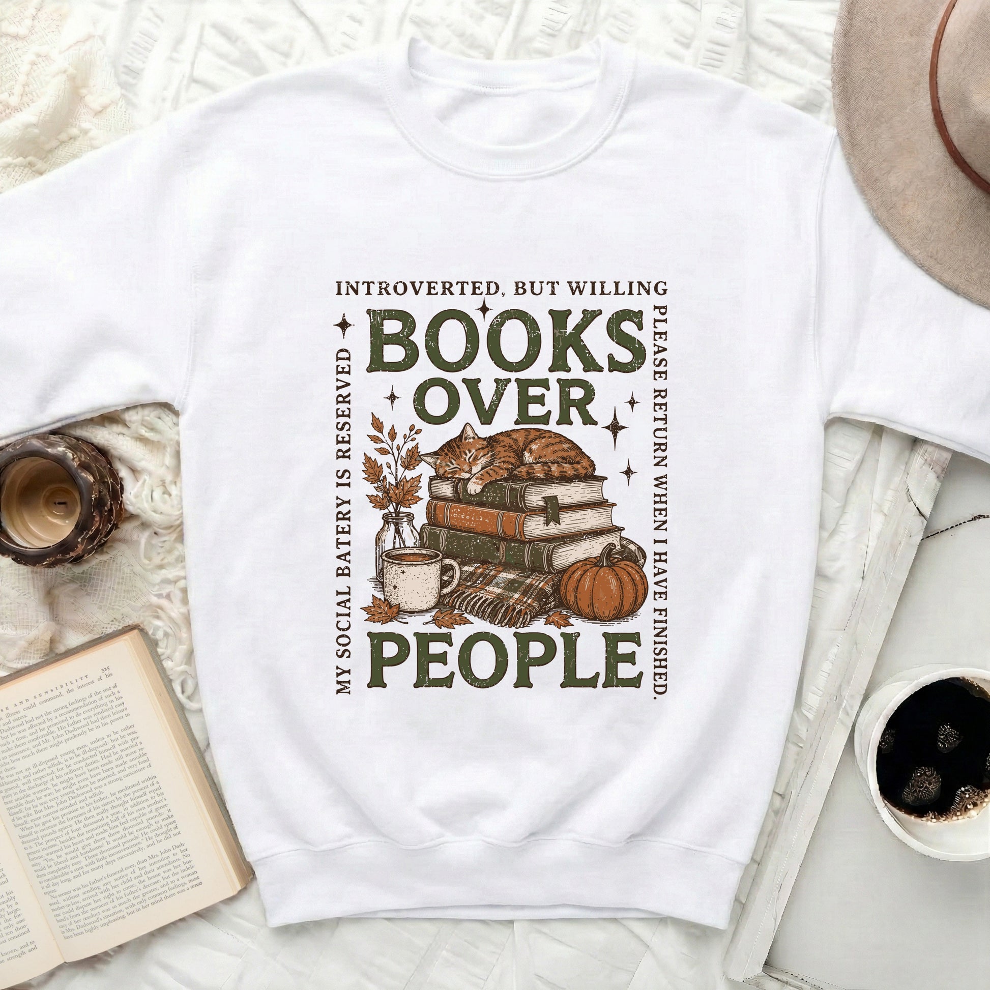 White sweatshirt with "Books Over People" graphic and sleeping cat.