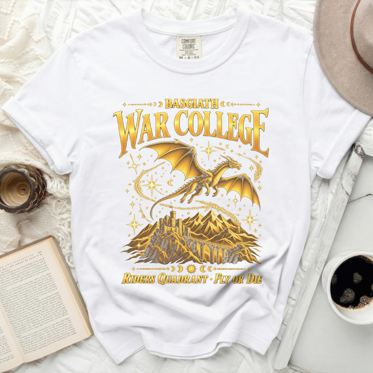 White t-shirt with gold dragon, castle, and text: Basgiath War College, Riders Quadrant Fly or Die.