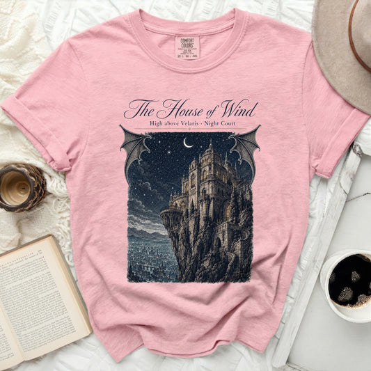 Pink t-shirt with "The House of Wind" and castle illustration.
