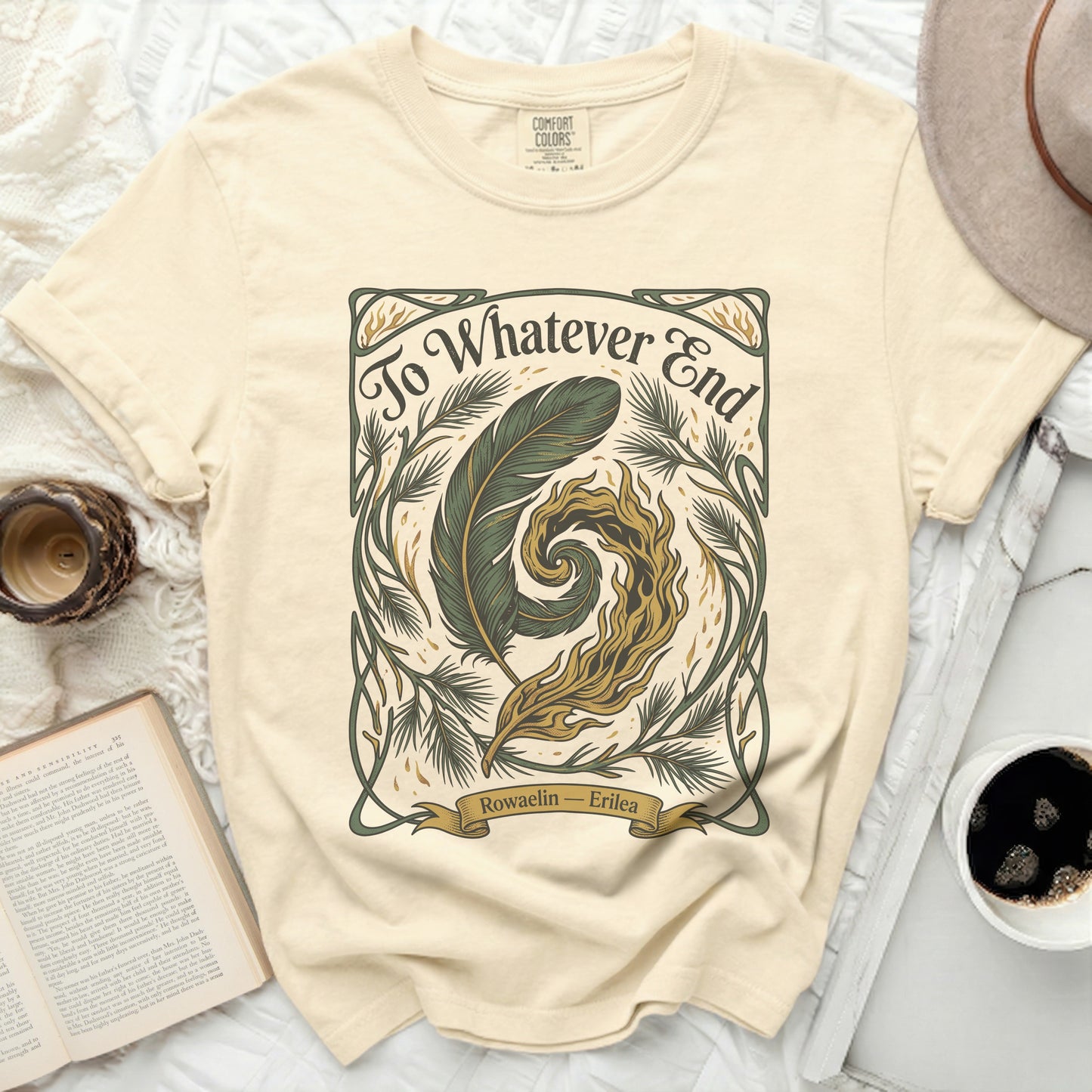 Cream t-shirt with "To Whatever End" and feather/swirl design.