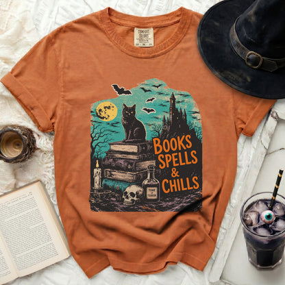 Orange t-shirt with a vintage Halloween graphic of a black cat and castle.