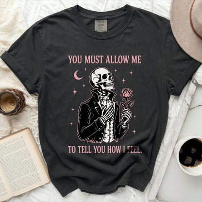 Black t-shirt with a skeleton graphic holding a rose and text.