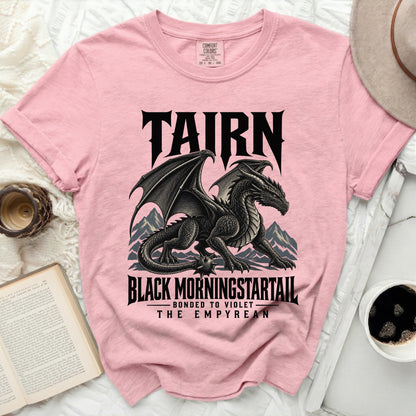 Pink t-shirt with black dragon graphic and text "TAIRN BLACK MORNINGSTARTAIL THE EMPYREAN".