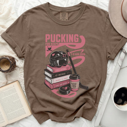 Brown t-shirt with "Pucking for Keeps" bookish theme graphics.