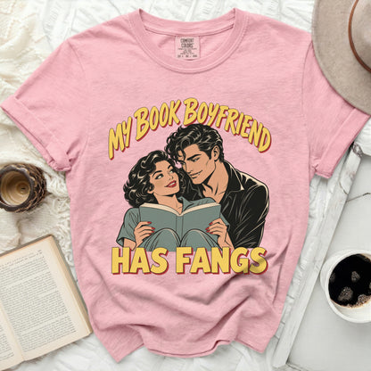Pink t-shirt with "My Book Boyfriend Has Fangs" graphic of a couple reading