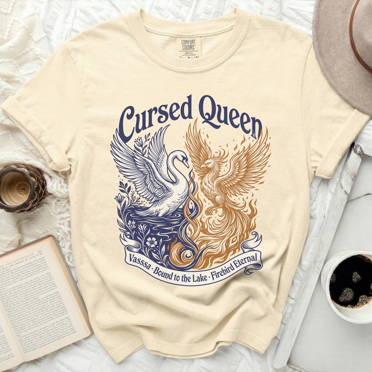 Cream t-shirt with "Cursed Queen" and phoenix and swan design.