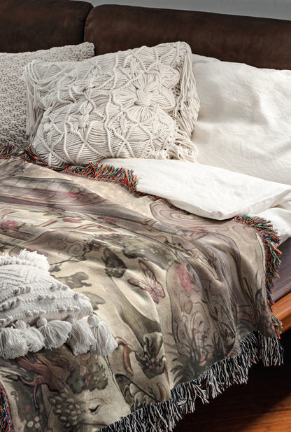 a cozy and inviting bedroom scene, featuring a bed with a white comforter and a decorative throw blanket with a floral pattern. The bed is adorned with two white pillows and a single throw blanket with fringe details. The overall scene conveys a sense of comfort and warmth, with the bed and bedding items creating a visually appealing and inviting atmosphere.