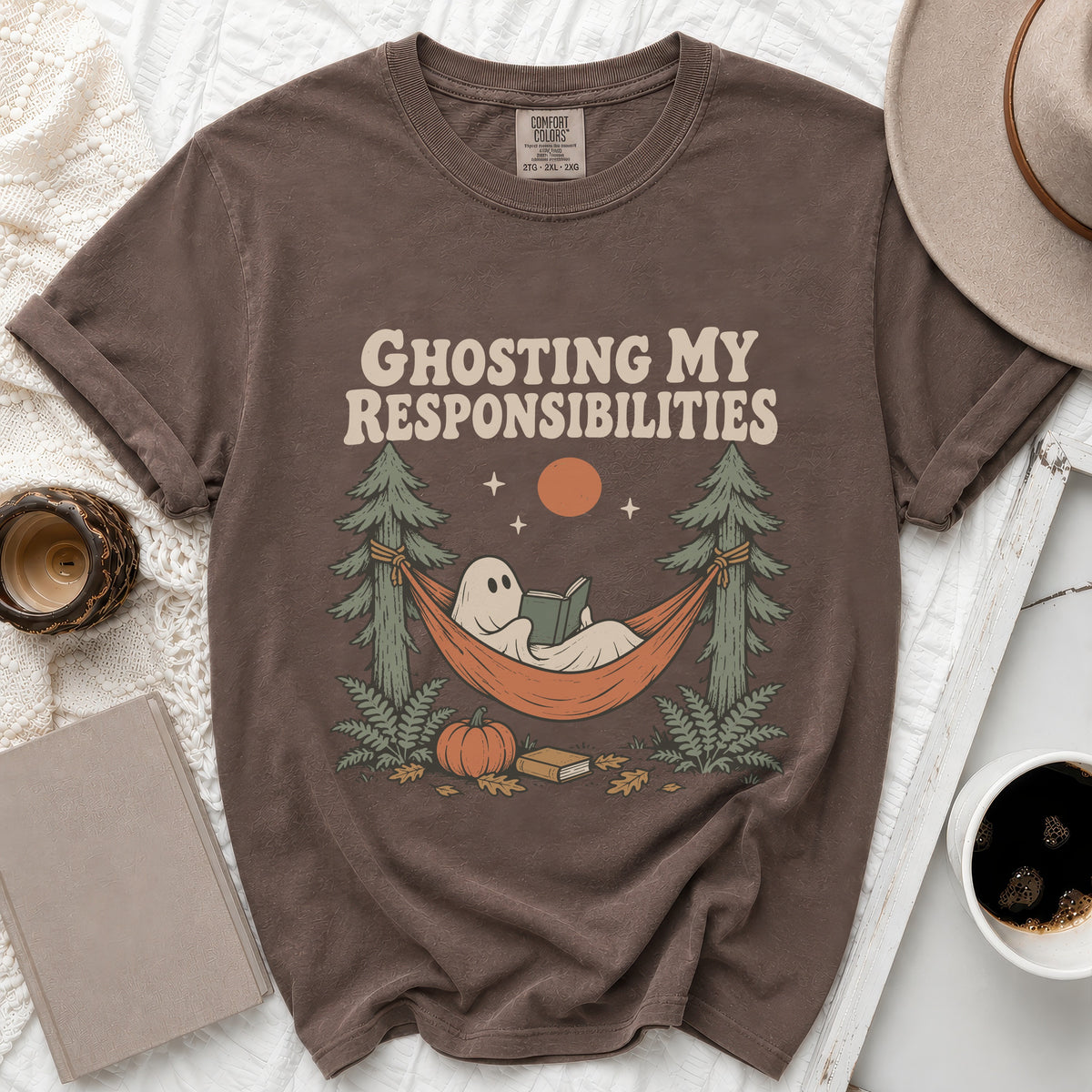 Brown t-shirt with ghost reading in hammock graphic and "Ghosting My Responsibilities" text.