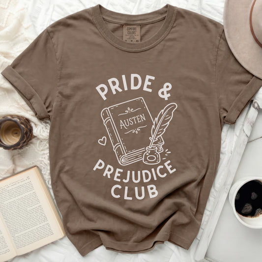 Brown t-shirt with "Pride & Prejudice Club" text and book illustration.